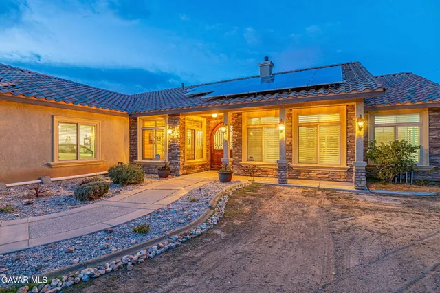a front view of a house with a ocean view