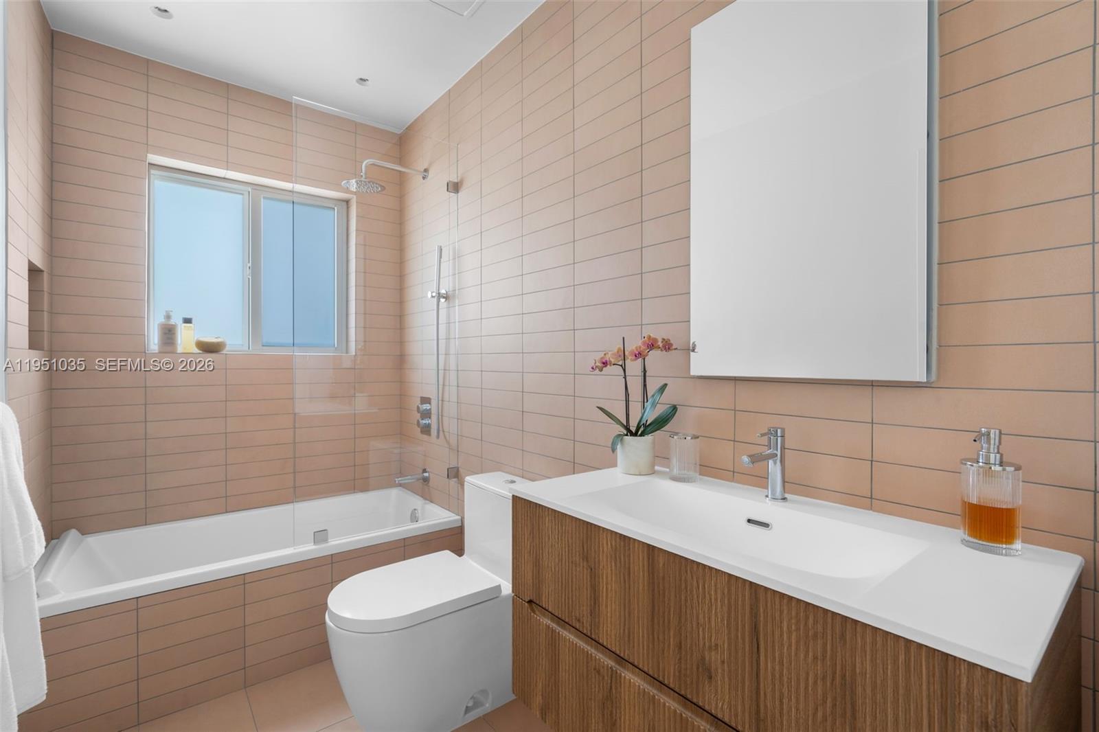 1040 Northeast 85th Street Miami, FL 33138 - Photo 19 of 22 a bathroom with a sink and a bathtub