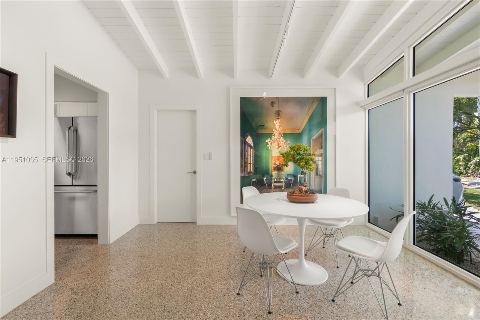 1040 Northeast 85th Street Miami, FL 33138 - Photo 8 of 22 a dining room with furniture and window