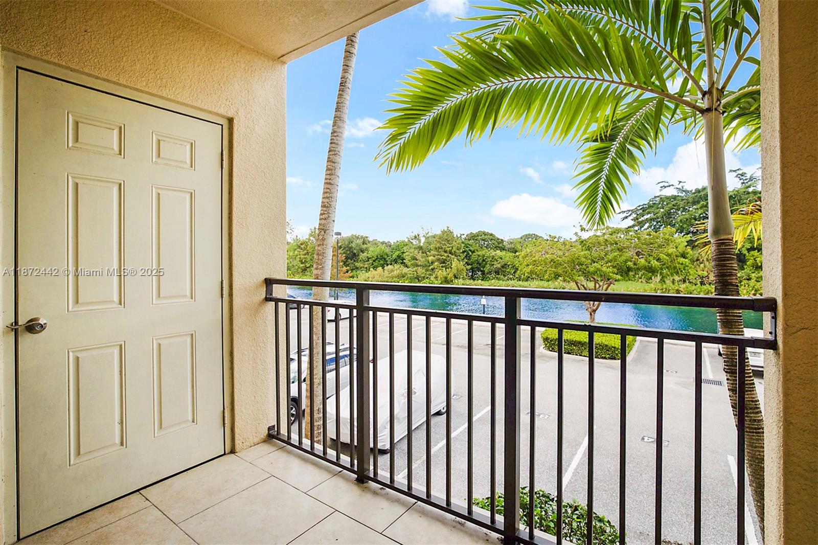 4905 Midtown Lane, Unit 2209 Palm Beach Gardens, FL 33418 - Photo 19 of 30 a view of a balcony with wooden floor