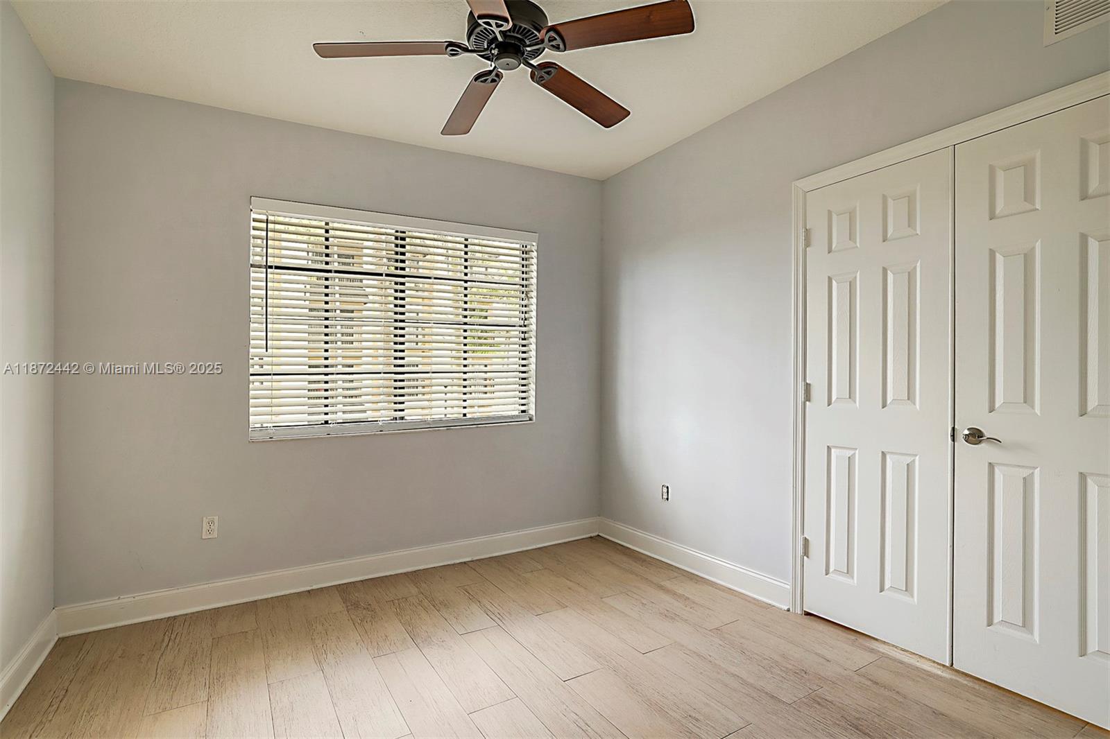 4905 Midtown Lane, Unit 2209 Palm Beach Gardens, FL 33418 - Photo 21 of 30 a view of an empty room with a window