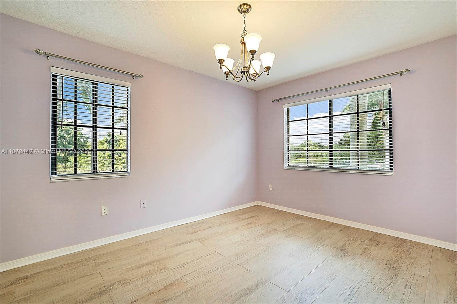 4905 Midtown Lane, Unit 2209 Palm Beach Gardens, FL 33418 - Photo 22 of 30 wooden floor in an empty room with a window