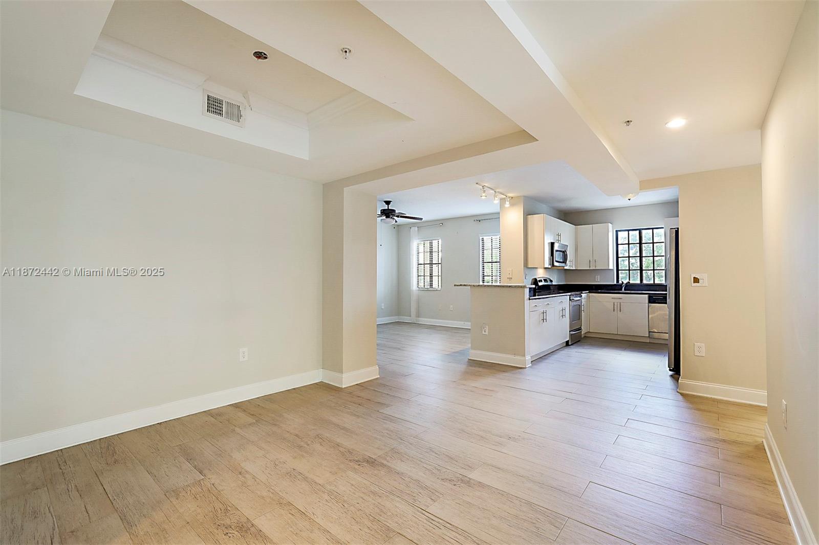 4905 Midtown Lane, Unit 2209 Palm Beach Gardens, FL 33418 - Photo 8 of 30 a view of kitchen with wooden floor