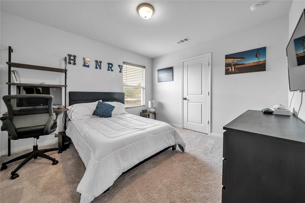 3581 Chestnut Oak Drive Dallas, TX 75253 - Photo 12 of 21 a bedroom with a bed and a desk