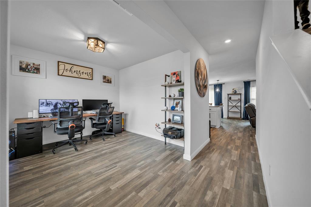 3581 Chestnut Oak Drive Dallas, TX 75253 - Photo 2 of 21 a view of a workspace with furniture and wooden floor