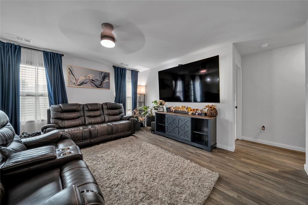 3581 Chestnut Oak Drive Dallas, TX 75253 - Photo 3 of 21 a living room with furniture and a flat screen tv