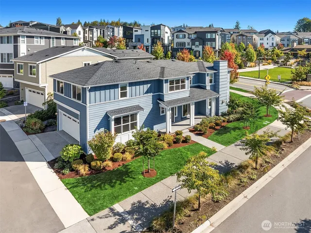 a front view of a residential apartment building with a yard