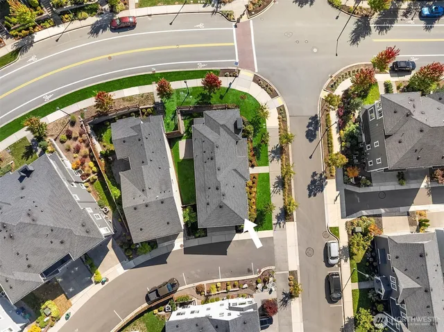 an aerial view of multiple house with a yard