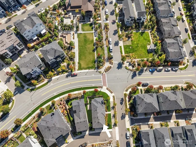 an aerial view of a swimming pool with outdoor seating