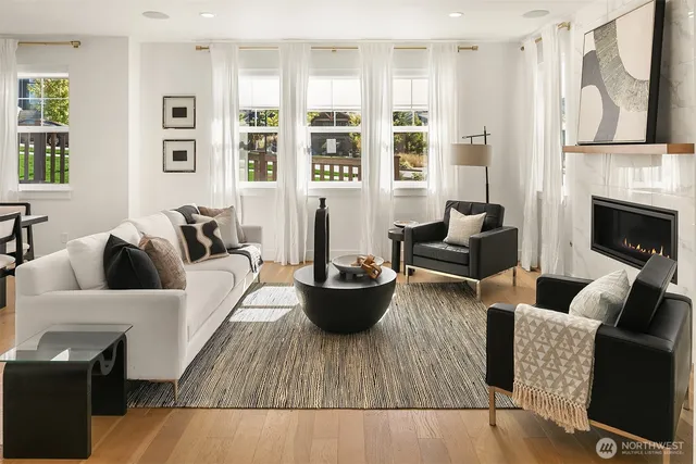 a living room with furniture and fireplace