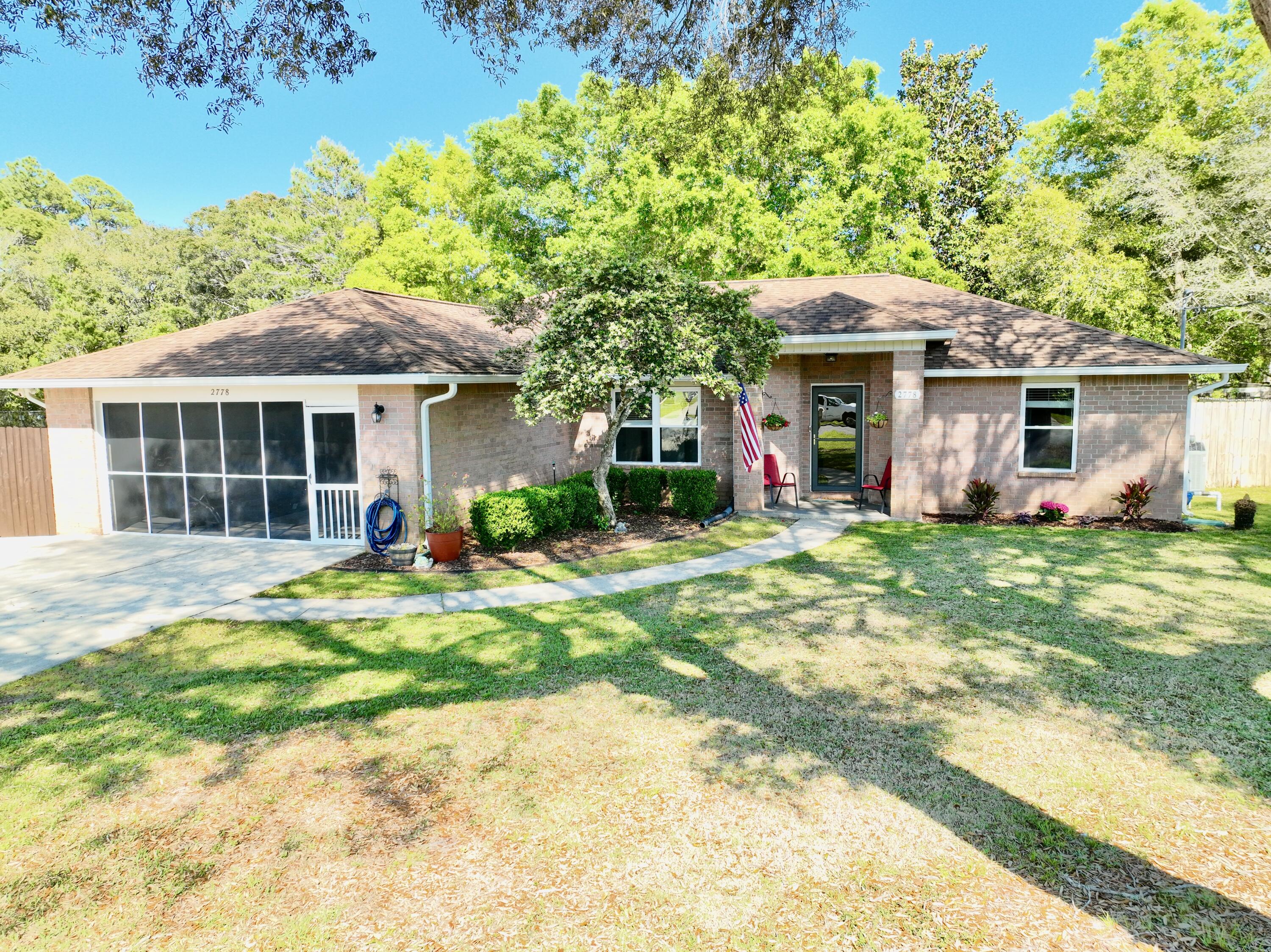 2778 Riverside Landing Drive Navarre, FL 32566 - Photo 2 of 62 dji_fly_20250412_152854_445_174458691686