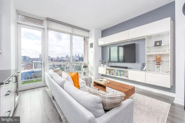 a living room with furniture and a large window