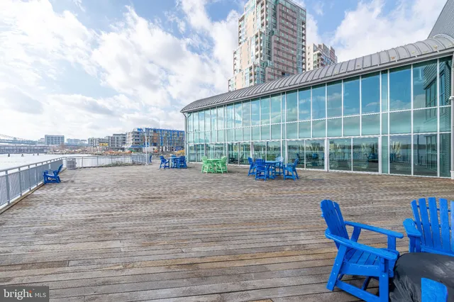 a terrace with outdoor seating and city view