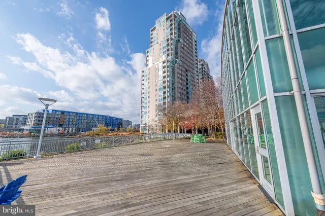 a view of swimming pool with seating space