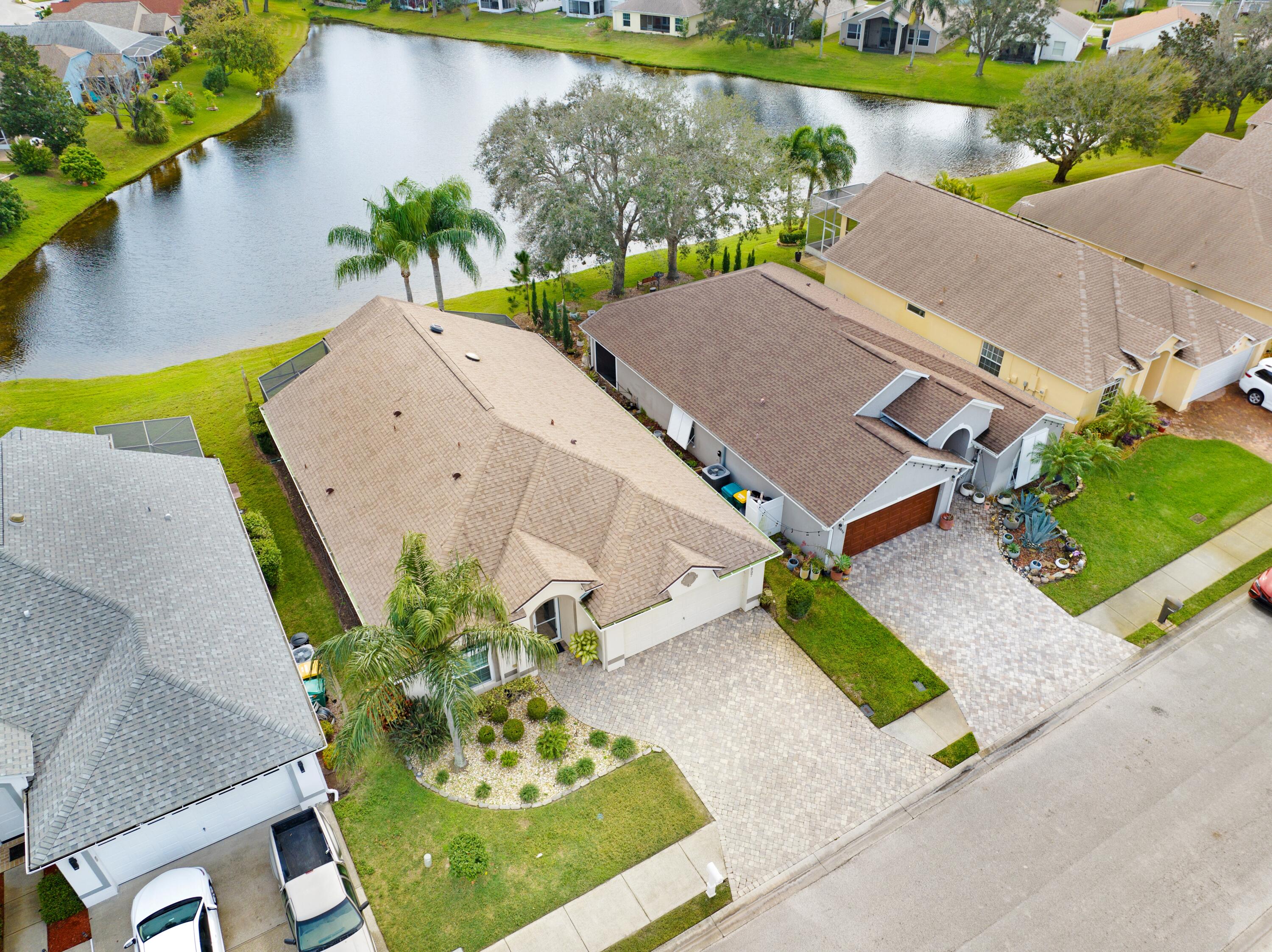 897 Shaw Circle Melbourne, FL 32940 - Photo 12 of 57 an aerial view of a house with a yard and a fountain