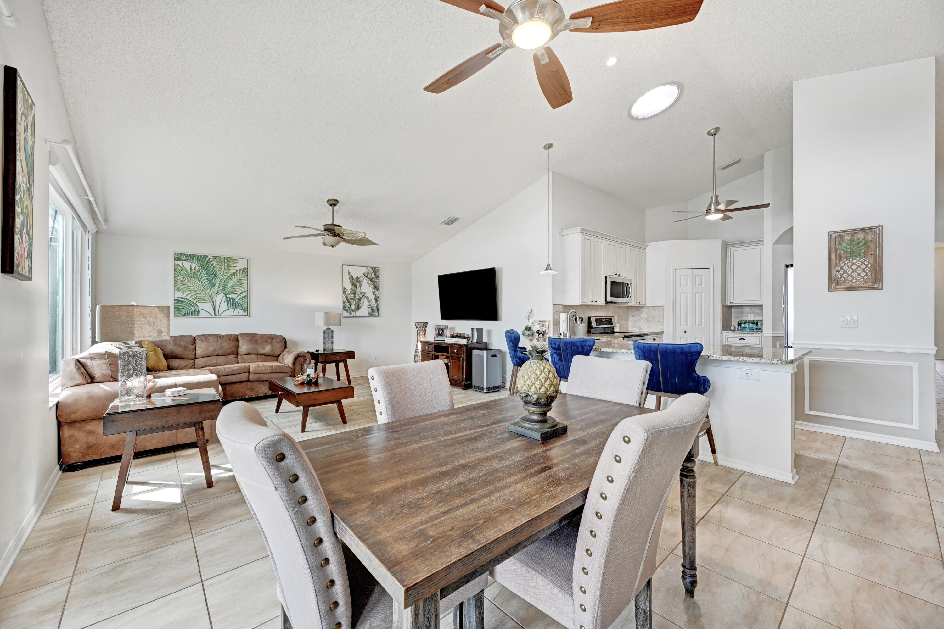 897 Shaw Circle Melbourne, FL 32940 - Photo 15 of 57 a living room with lots of furniture and a flat screen tv
