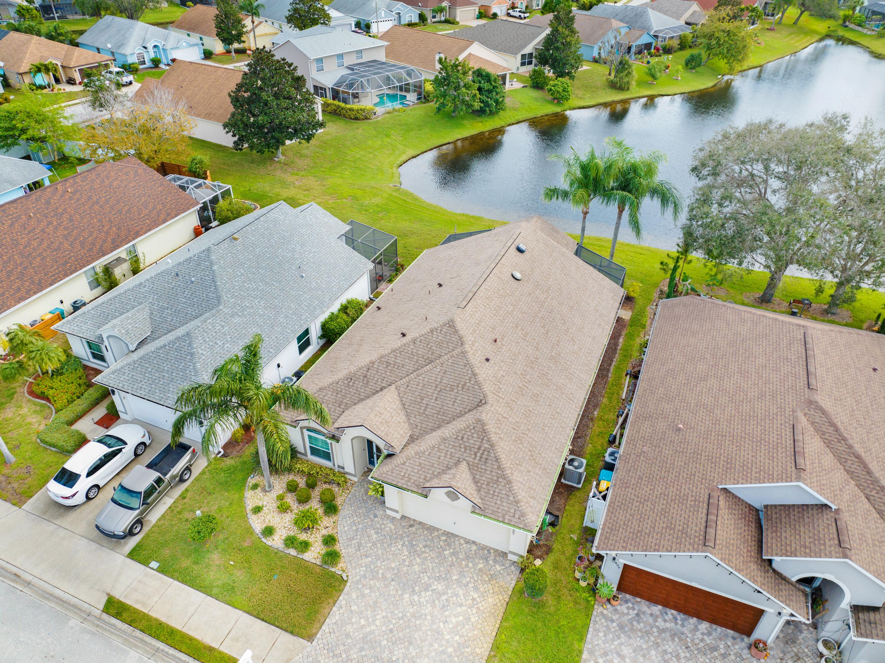897 Shaw Circle Melbourne, FL 32940 - Photo 18 of 57 an aerial view of a house with a swimming pool