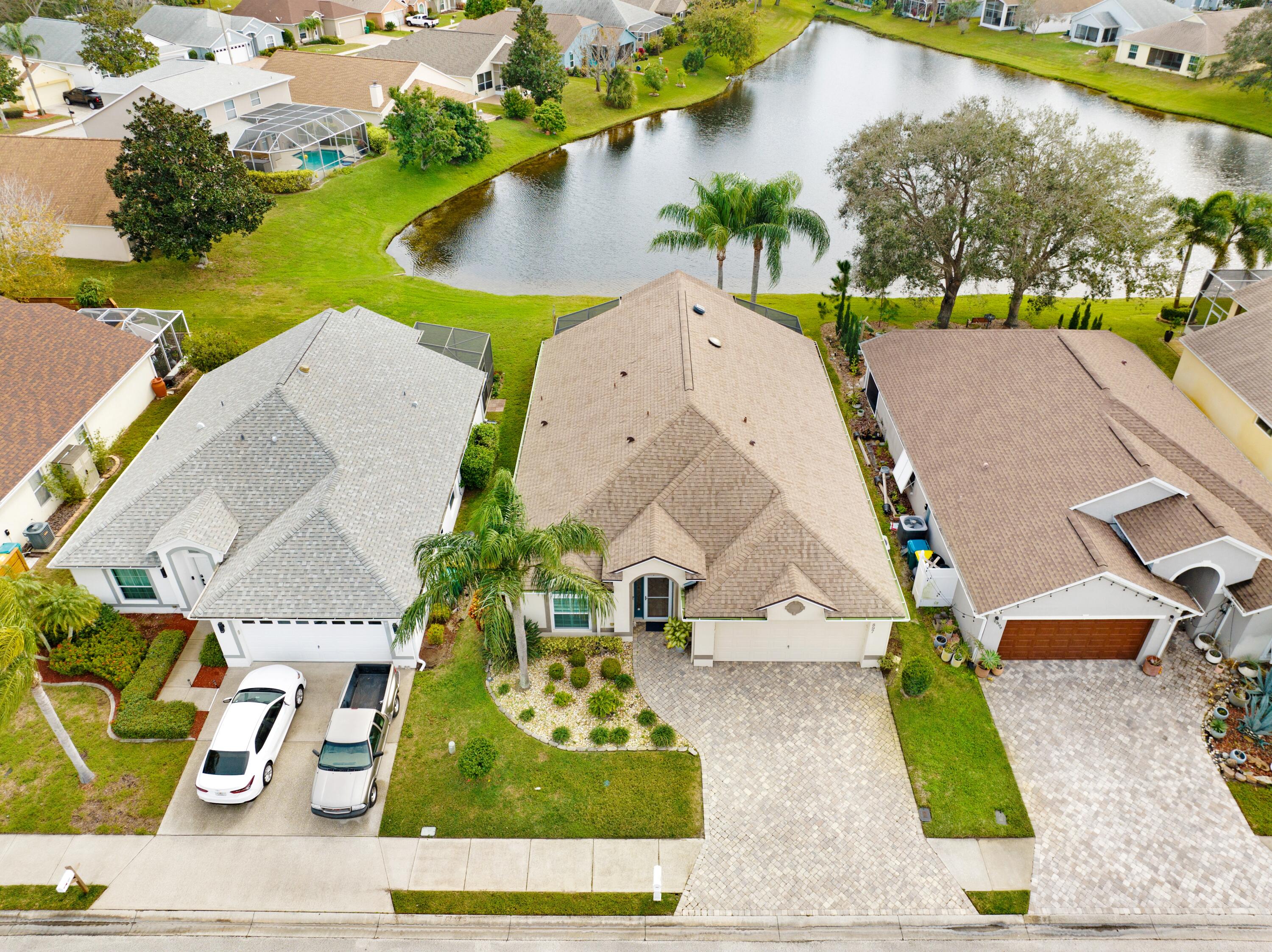 897 Shaw Circle Melbourne, FL 32940 - Photo 19 of 57 an aerial view of residential house with outdoor space and swimming pool