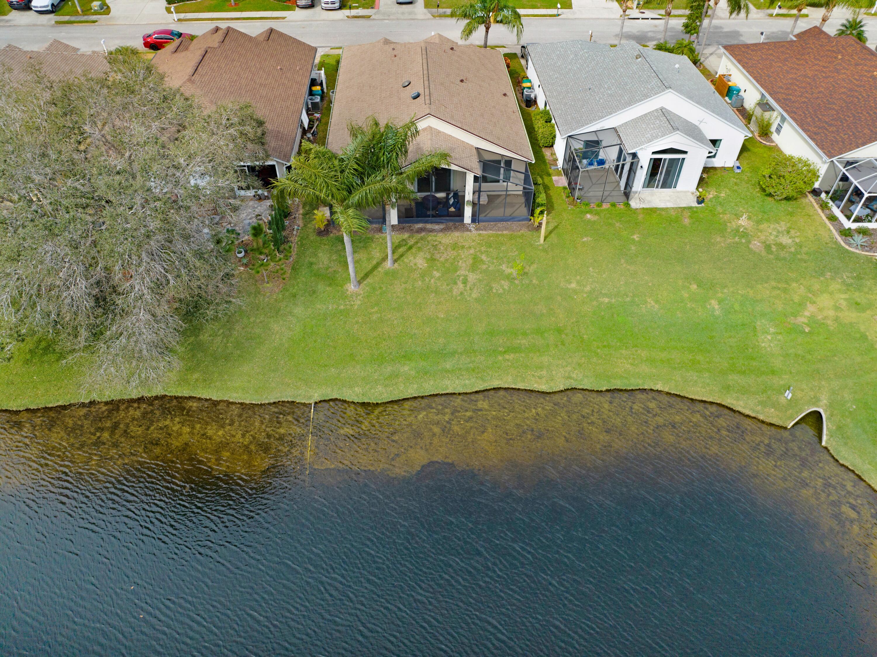 897 Shaw Circle Melbourne, FL 32940 - Photo 21 of 57 an aerial view of a house with a yard