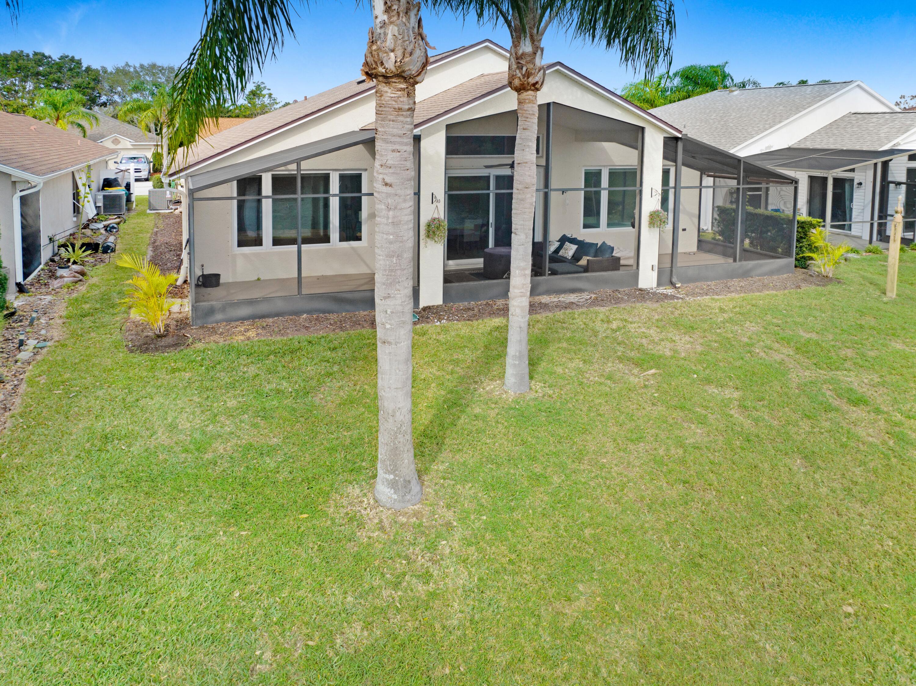 897 Shaw Circle Melbourne, FL 32940 - Photo 22 of 57 a backyard of a house with yard and porch