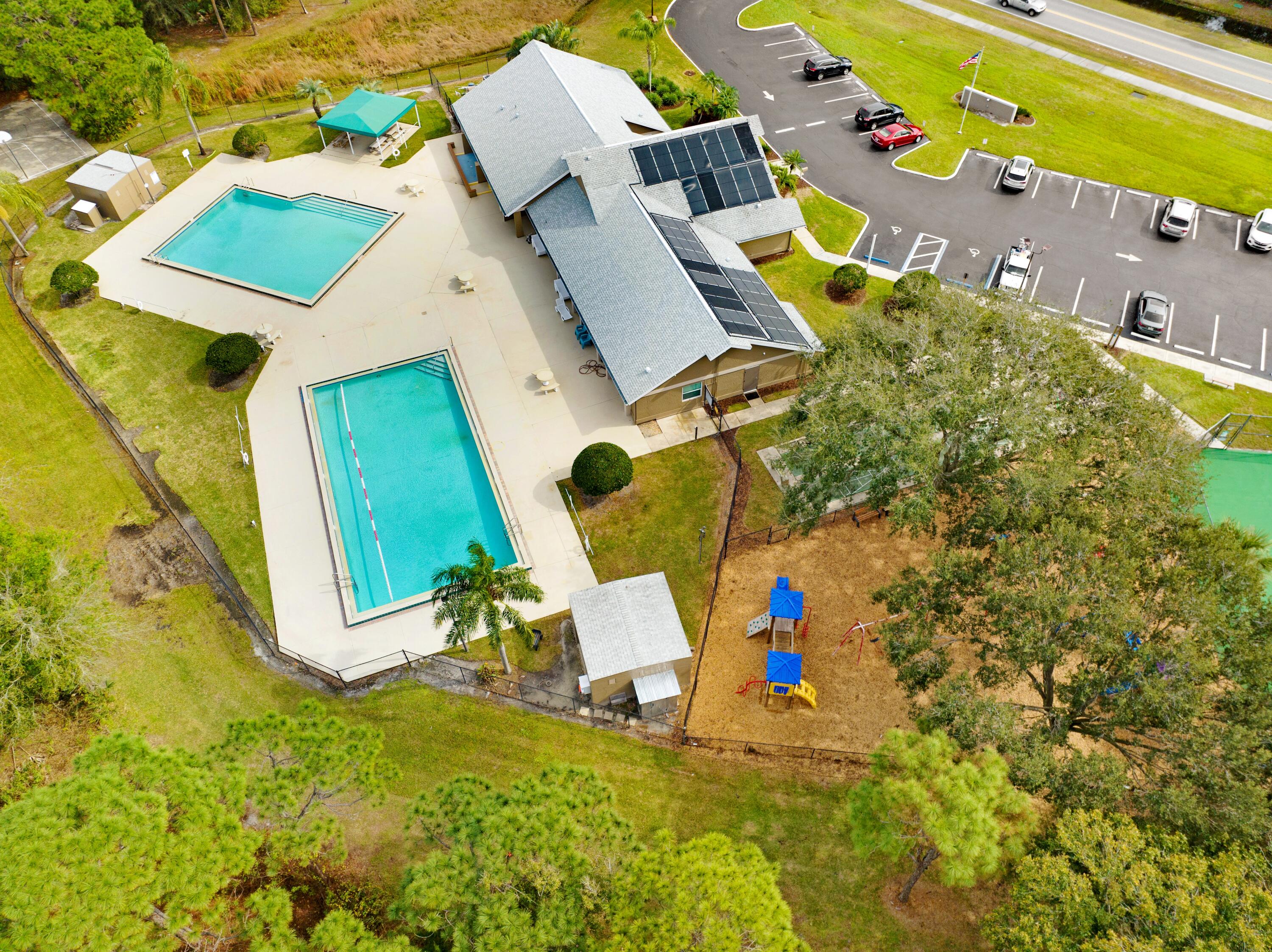 897 Shaw Circle Melbourne, FL 32940 - Photo 37 of 57 an aerial view of a house with swimming pool and porch