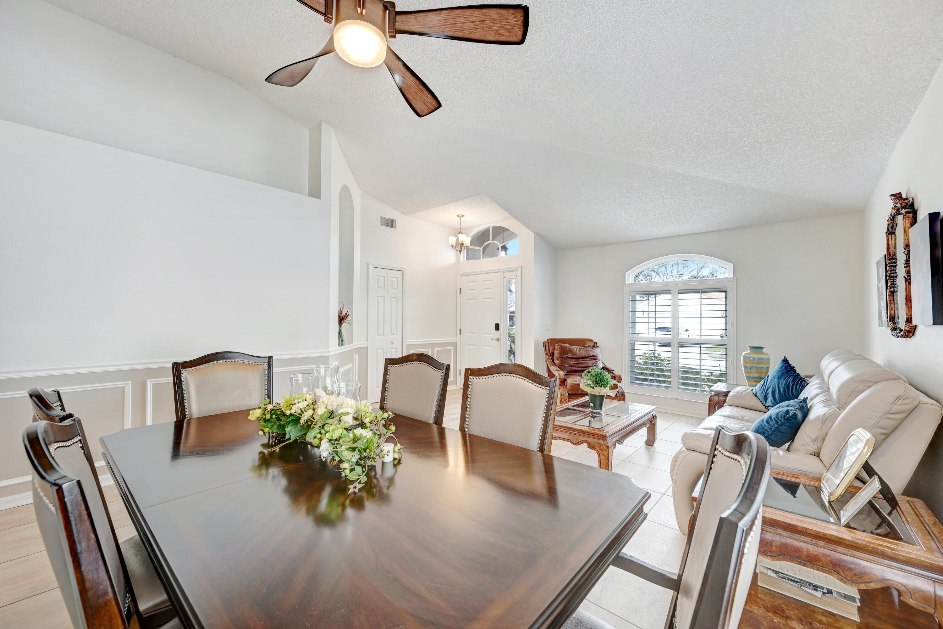 897 Shaw Circle Melbourne, FL 32940 - Photo 45 of 57 a view of a dining room with furniture window and wooden floor