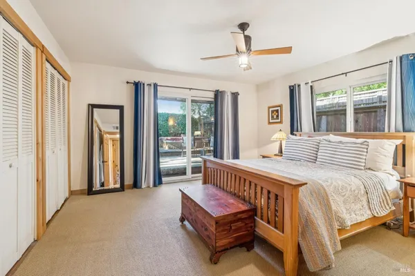 a bathroom with a sink a mirror and toilet