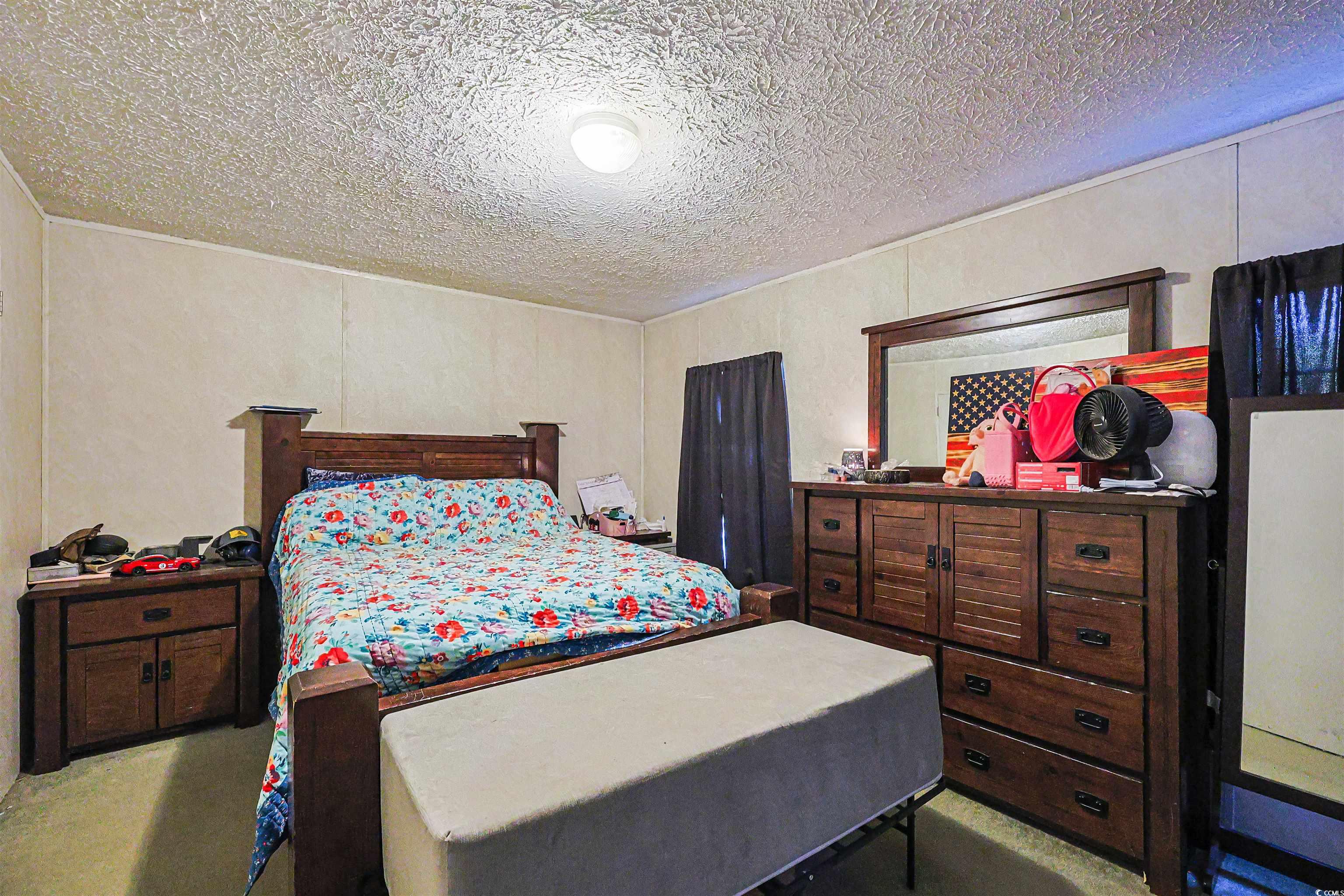 2128 Harvey Road Loris, SC 29569 - Photo 15 of 31 Bedroom featuring a textured ceiling and light carpet