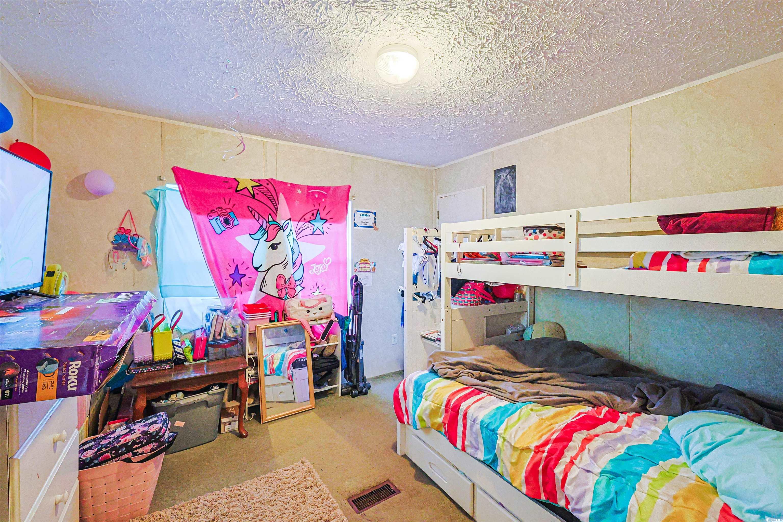 2128 Harvey Road Loris, SC 29569 - Photo 18 of 31 Bedroom with a textured ceiling
