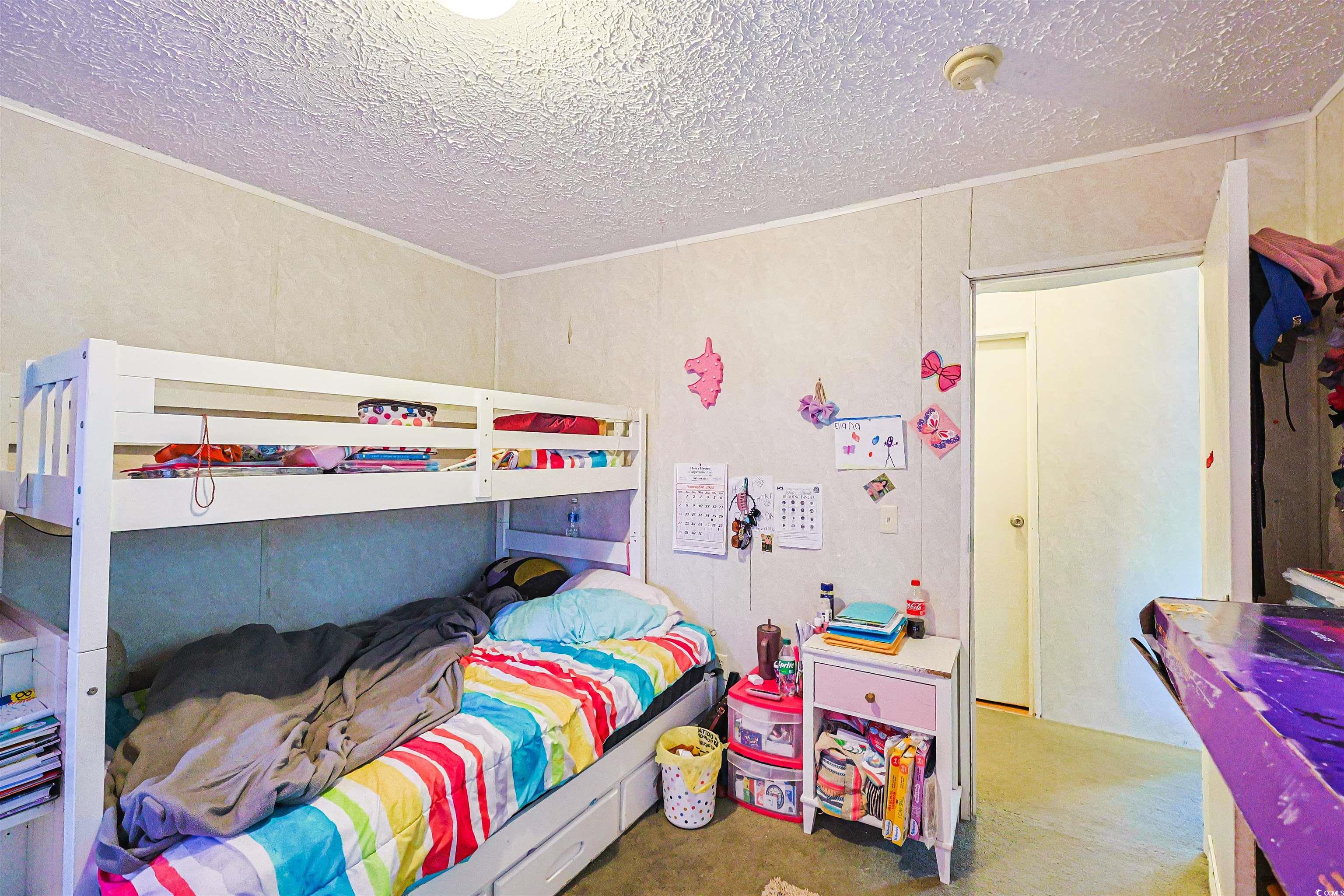 2128 Harvey Road Loris, SC 29569 - Photo 19 of 31 Bedroom featuring a textured ceiling