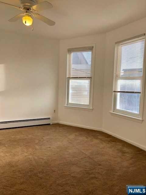 21 Columbus Street Bloomfield, NJ 07003 - Photo 11 of 20 a view of an empty room with a window