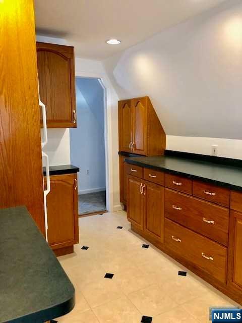 21 Columbus Street Bloomfield, NJ 07003 - Photo 17 of 20 a bathroom with a sink and a mirror