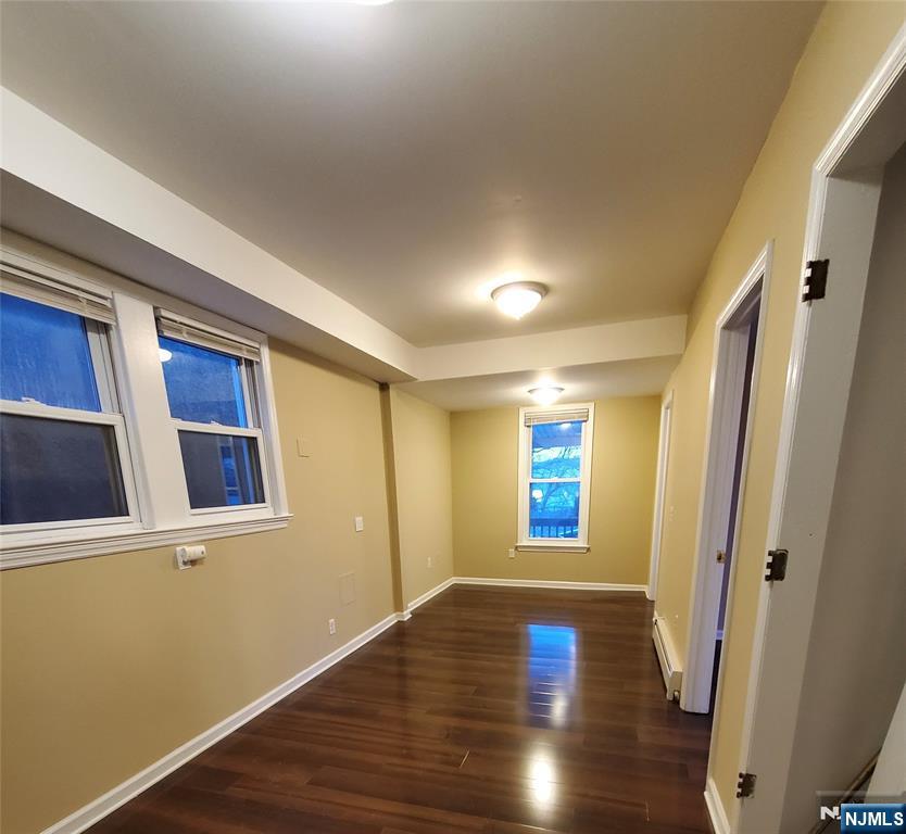 21 Columbus Street Bloomfield, NJ 07003 - Photo 4 of 20 a view of a livingroom with wooden floor and window