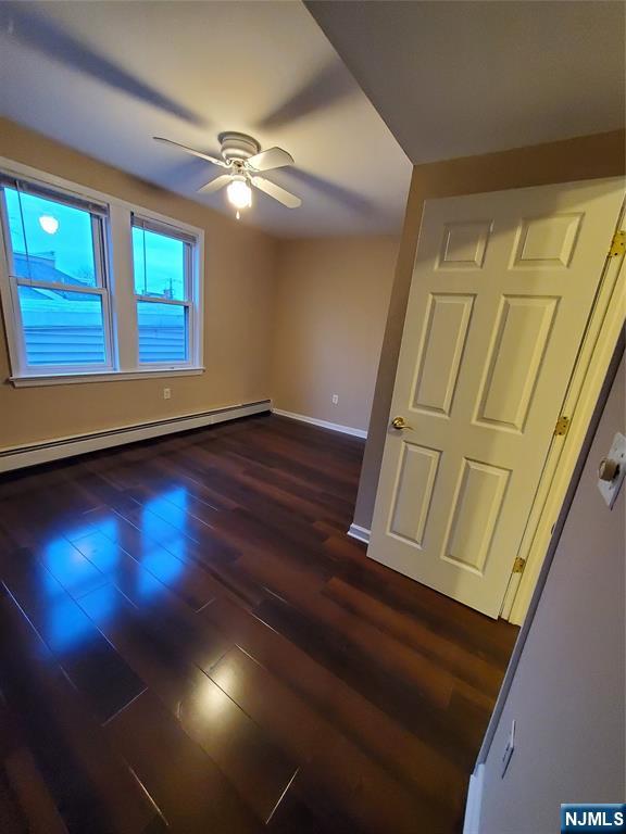 21 Columbus Street Bloomfield, NJ 07003 - Photo 7 of 20 a view of an empty room with wooden floor and a window