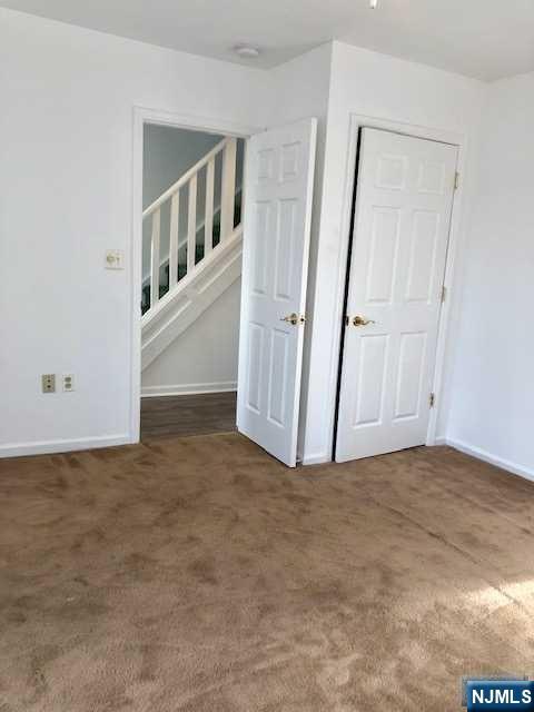 21 Columbus Street Bloomfield, NJ 07003 - Photo 10 of 20 an empty room with windows
