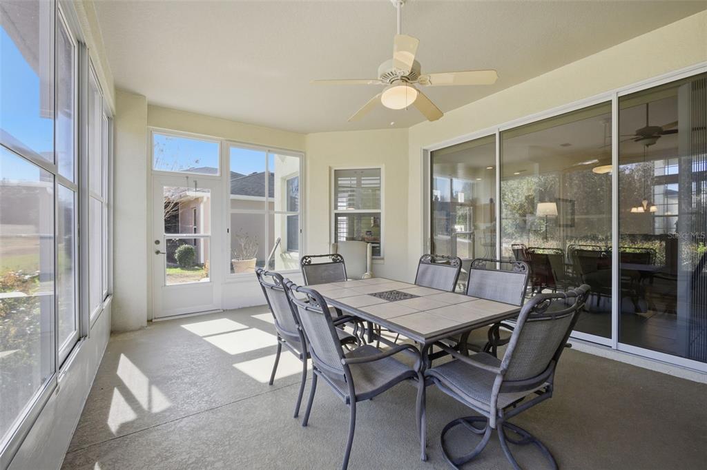 5922 Sage Leaf Place Leesburg, FL 34748 - Photo 25 of 39 a dining room with furniture and window
