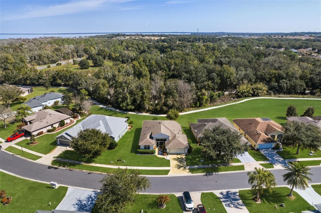 5922 Sage Leaf Place Leesburg, FL 34748 - Photo 27 of 39 an aerial view of a house with a garden
