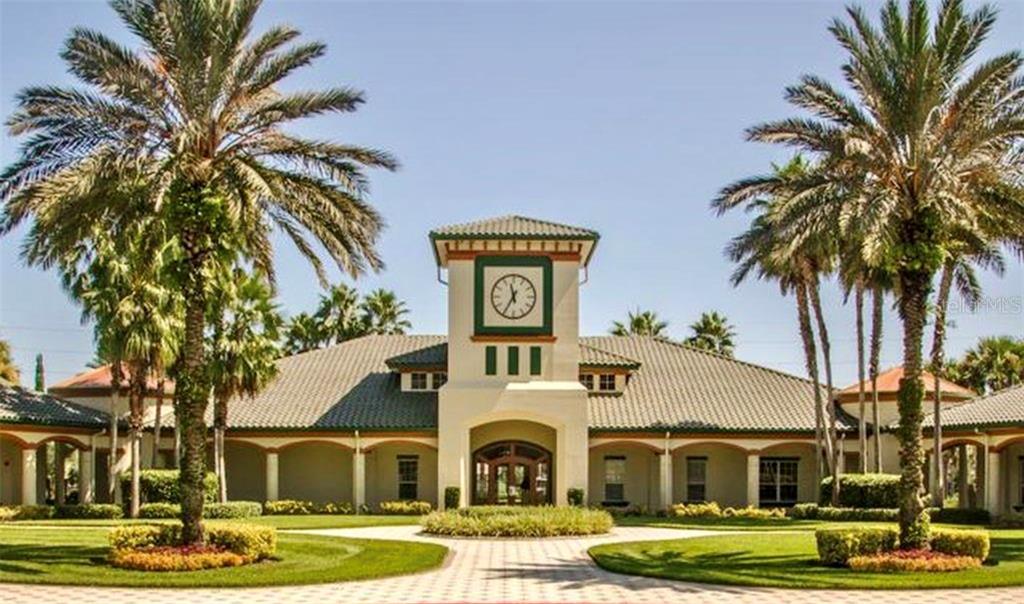 5922 Sage Leaf Place Leesburg, FL 34748 - Photo 31 of 39 a view of a white house with a big yard and palm trees