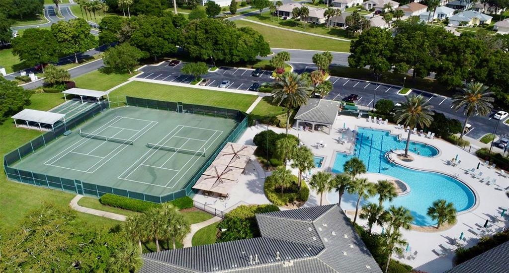 5922 Sage Leaf Place Leesburg, FL 34748 - Photo 32 of 39 an aerial view of a house with a garden and swimming pool
