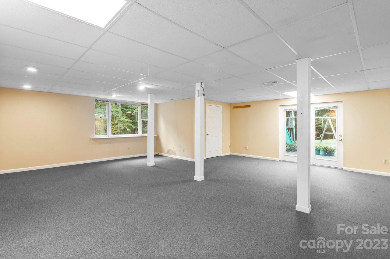 112 Walnut Street Lowell, NC 28098 - Photo 2 of 27 a view of an empty room with a window