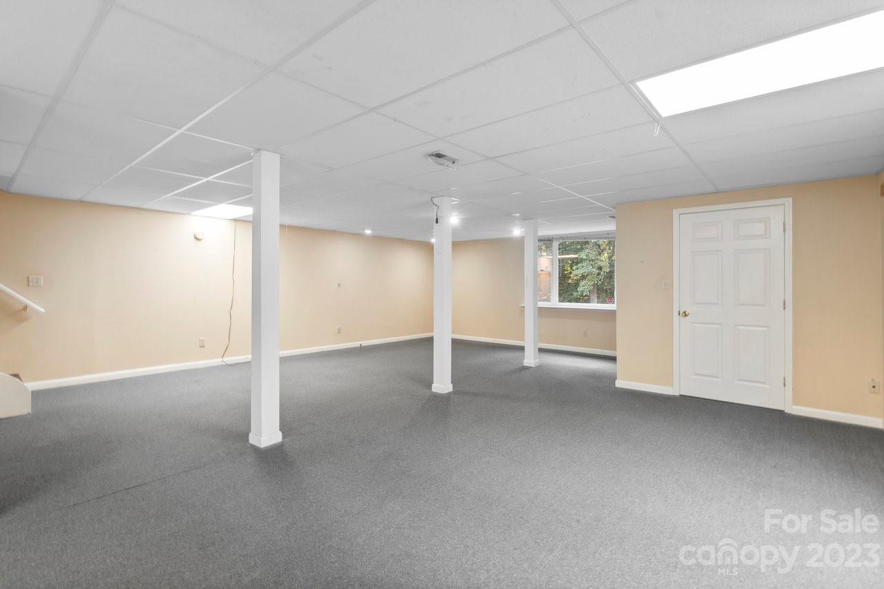 112 Walnut Street Lowell, NC 28098 - Photo 5 of 27 an empty room with a empty space