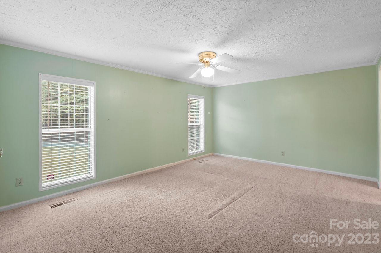 112 Walnut Street Lowell, NC 28098 - Photo 7 of 27 an empty room with windows