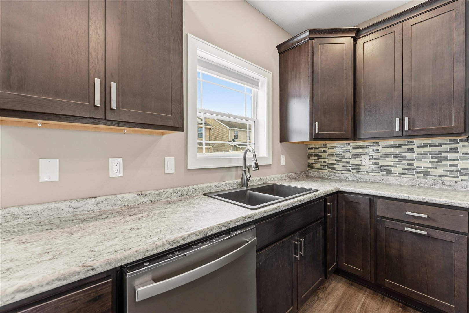 3411 Boulder Ridge Drive Champaign, IL 61822 - Photo 13 of 36 a kitchen with granite countertop a sink and cabinets