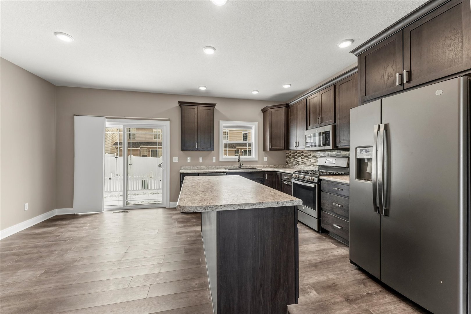 3411 Boulder Ridge Drive Champaign, IL 61822 - Photo 16 of 36 a kitchen with stainless steel appliances granite countertop a refrigerator a sink a stove and oven