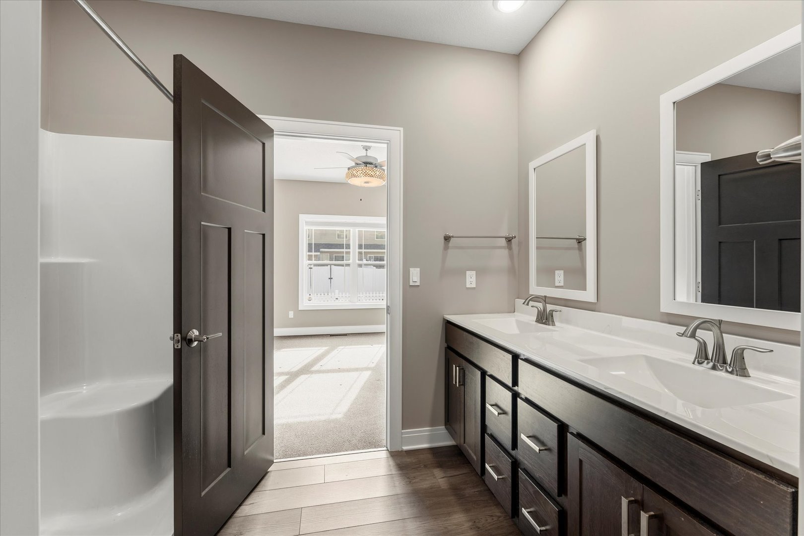 3411 Boulder Ridge Drive Champaign, IL 61822 - Photo 21 of 36 a en suite bathroom with a granite countertop sink and a mirror