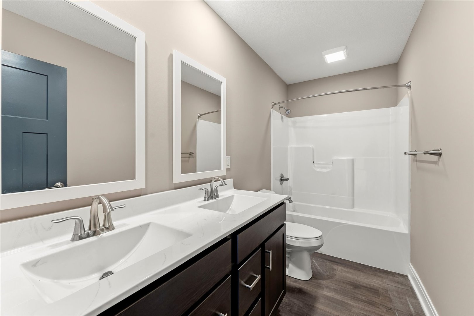 3411 Boulder Ridge Drive Champaign, IL 61822 - Photo 24 of 36 a bathroom with a double vanity sink toilet mirror and bathtub