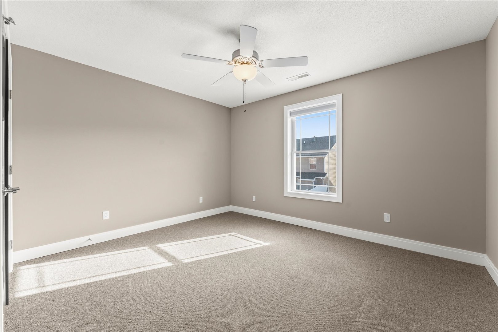 3411 Boulder Ridge Drive Champaign, IL 61822 - Photo 25 of 36 a view of an empty room with a window