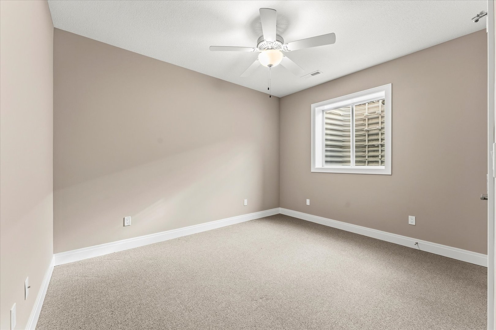 3411 Boulder Ridge Drive Champaign, IL 61822 - Photo 30 of 36 an empty room with a window