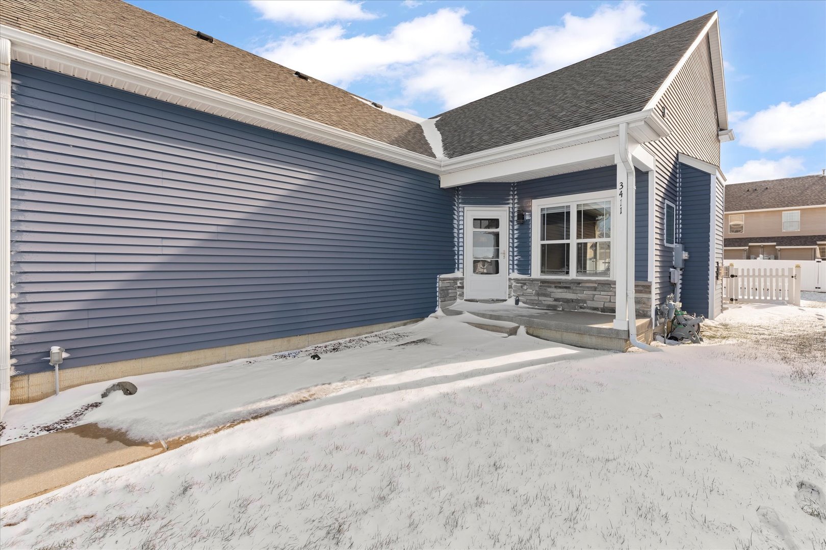 3411 Boulder Ridge Drive Champaign, IL 61822 - Photo 3 of 36 a view of a house with a yard and garage