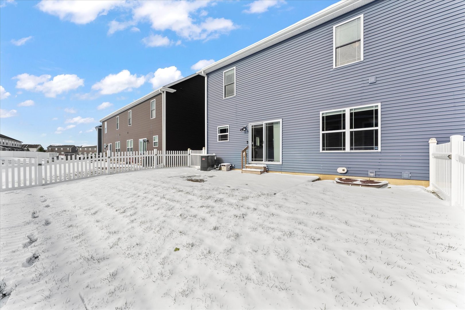 3411 Boulder Ridge Drive Champaign, IL 61822 - Photo 34 of 36 a view of house with yard and snow in the background